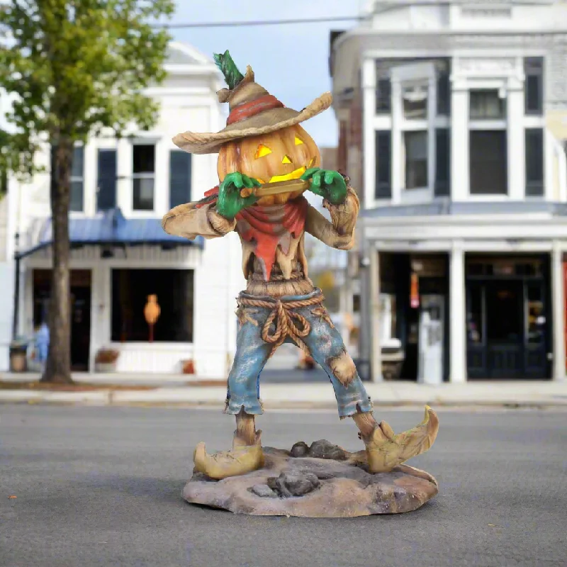 Pumpkin Scarecrow Playing Harmonica